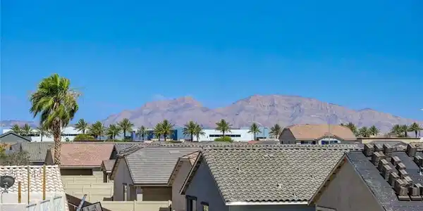 Image 2: A desert panorama showcasing community rooftops ag
