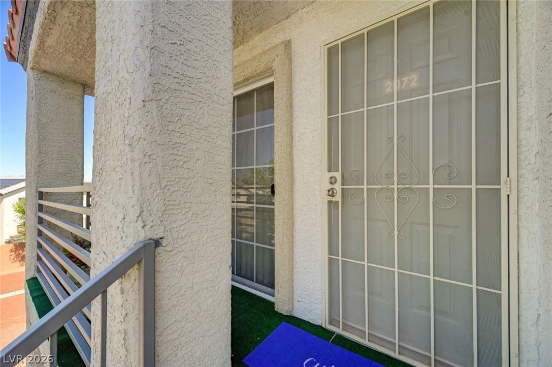 Image 4: Enter this well-lit entry through a decorative sec