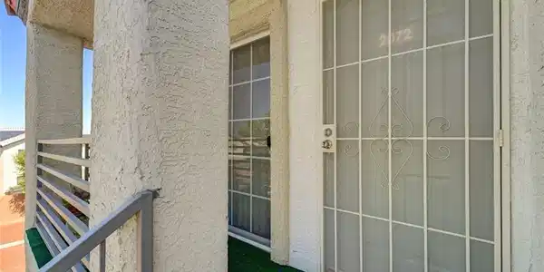 Image 4: Enter this well-lit entry through a decorative sec