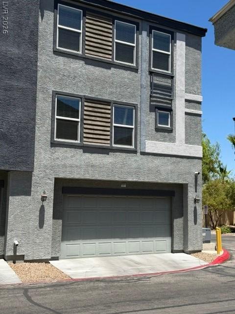 Image 2: A contemporary exterior showcasing textured stucco
