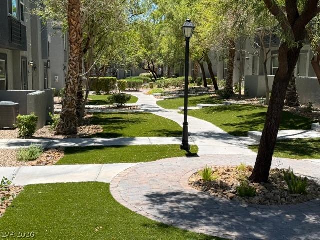Image 4: Winding pathways through green spaces lead to tran