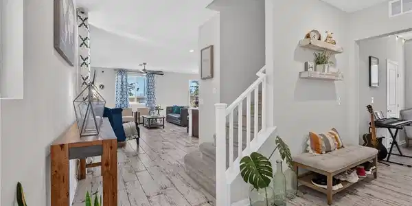 Image 2: An inviting entrance foyer showcases wood-look Por
