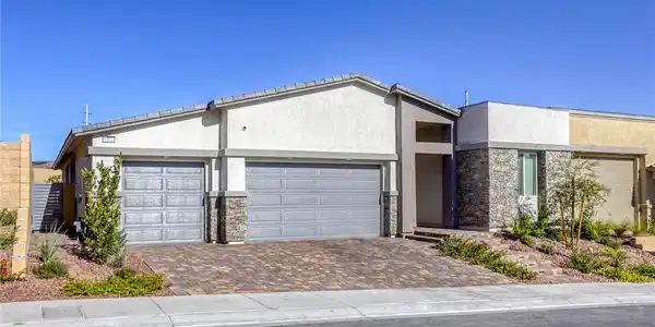 Image 2: Inviting exterior with paver driveway, 3-car garag