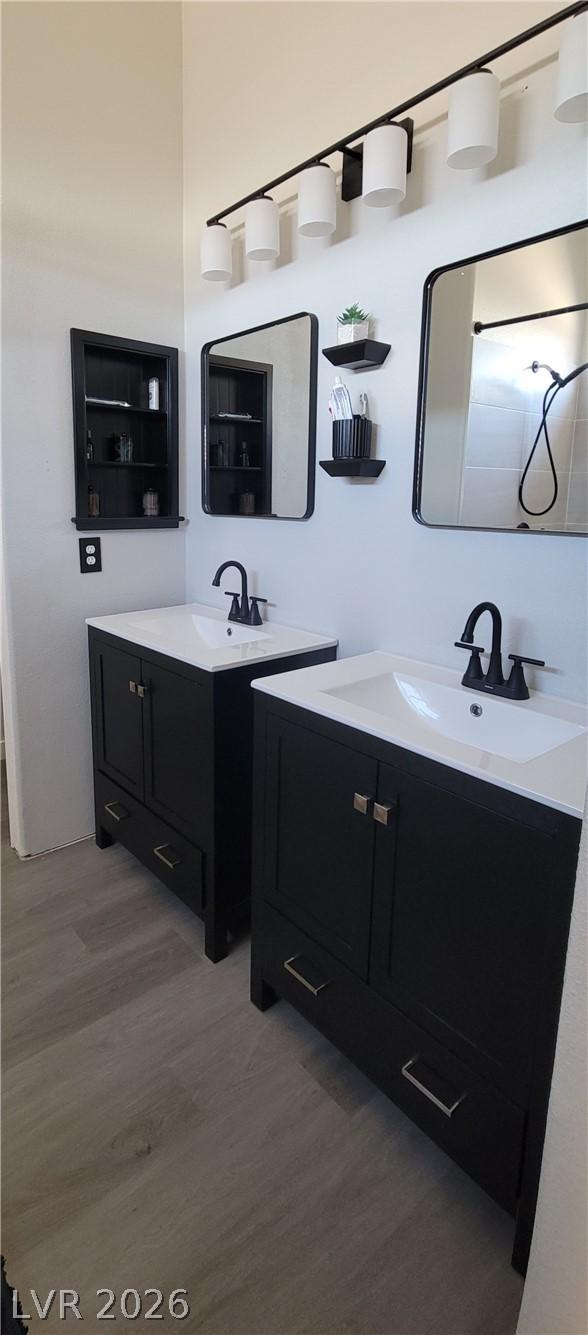 Image 4: Dual vanities with matte black hardware and white