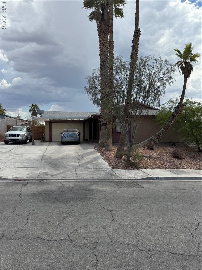 Image 2: An inviting driveway and neatly kept front yard we