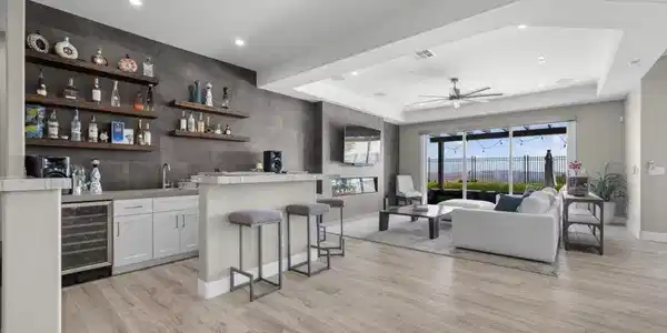 Image 3: Gleaming wood floors anchor this open living area