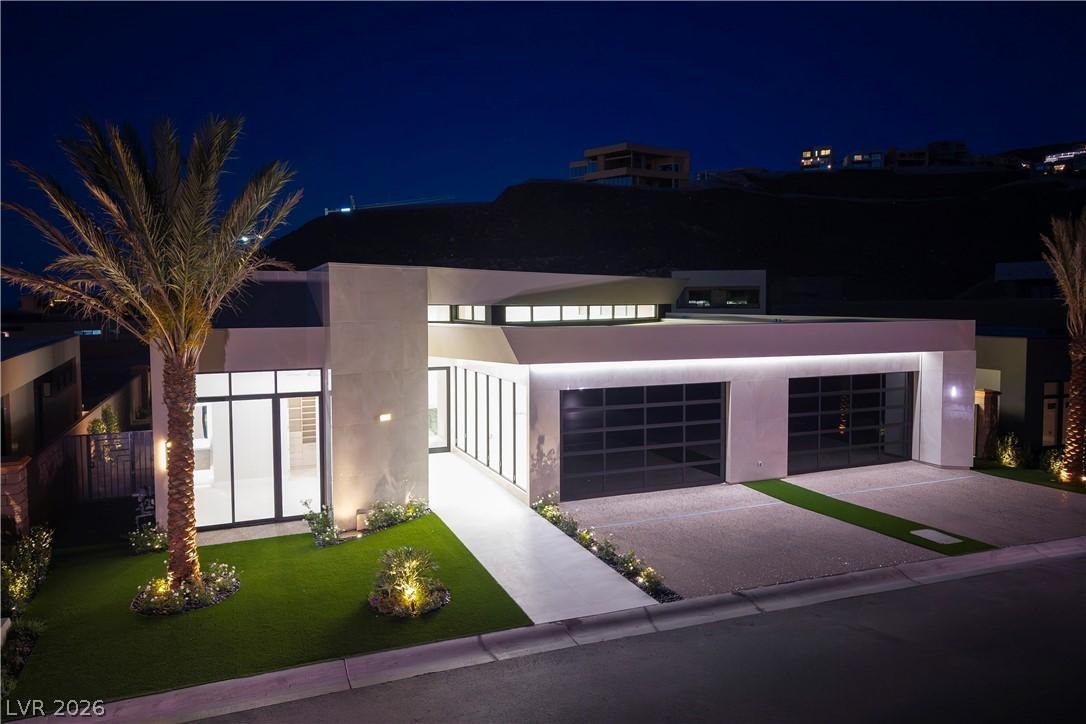 Image 3: Modern architecture with sleek lines and illuminat