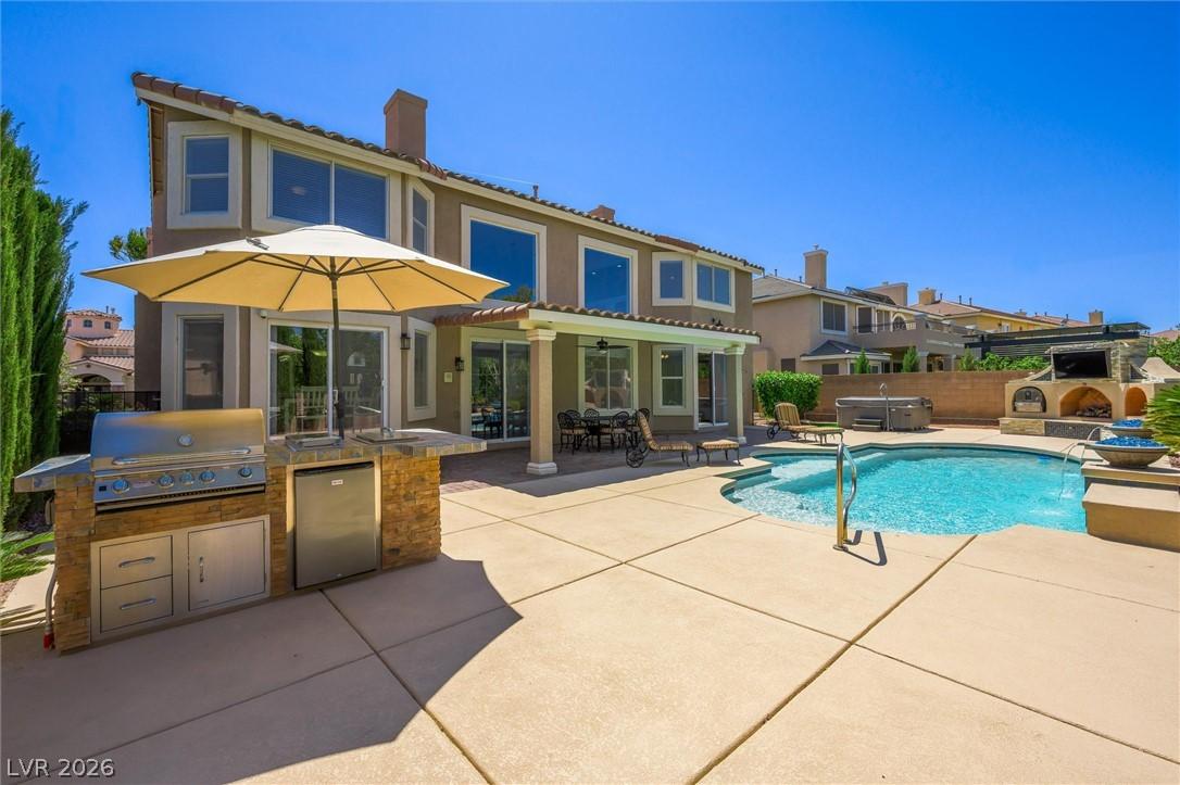 Image 2: A private backyard oasis features an inviting pool