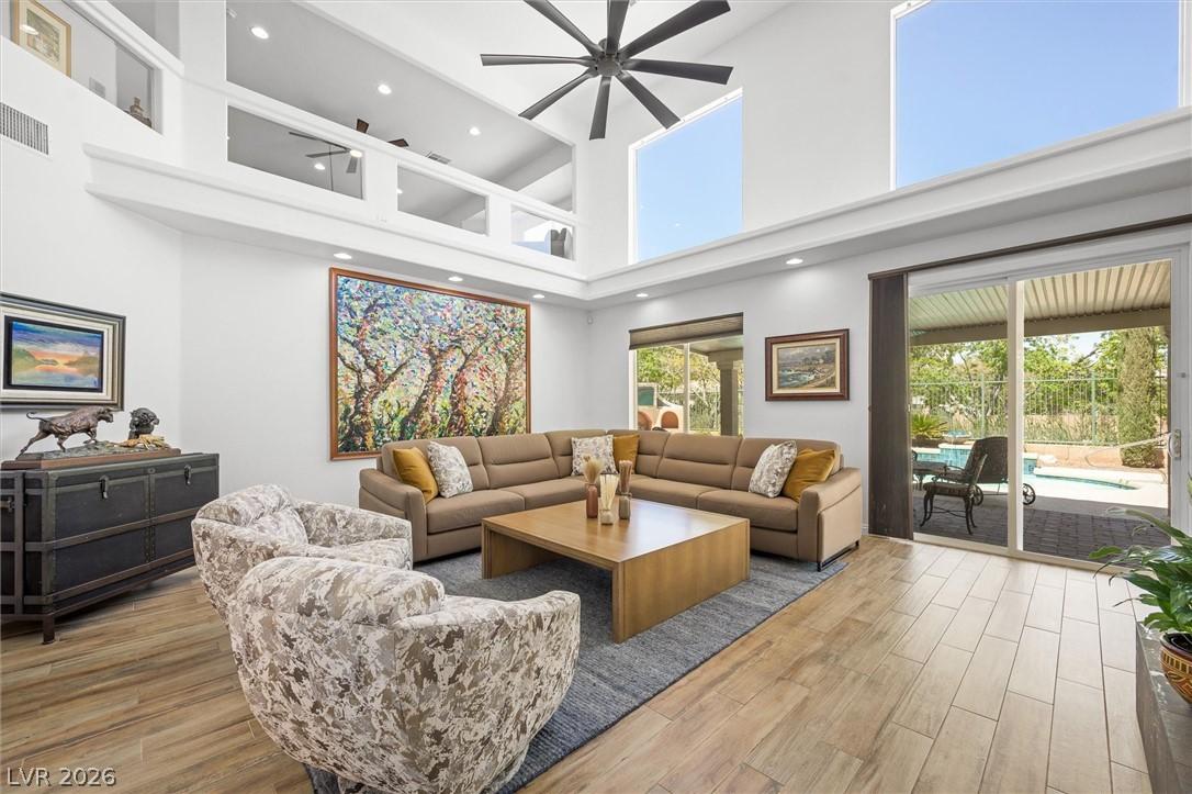 Image 3: Natural light floods this living space, featuring