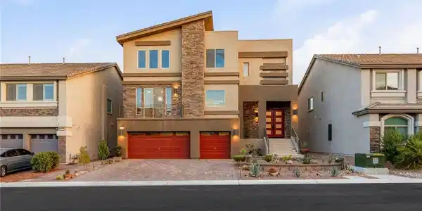 Image 3: Modern multi-level exterior displaying stone accen
