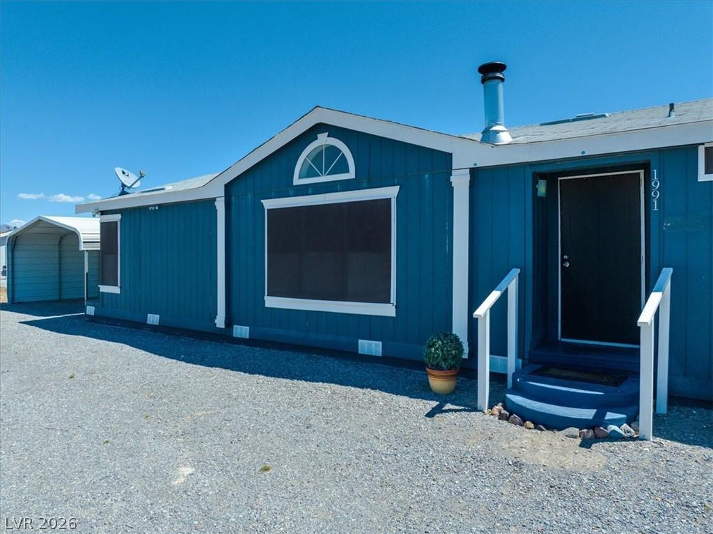 Image 3: This charming home offers a welcoming entrance wit