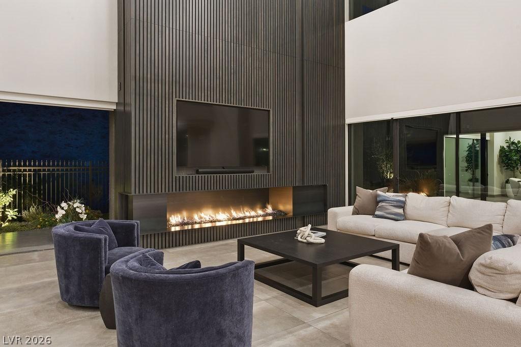 Image 4: Family Room with Maple-Clad Wall & Fire Feature