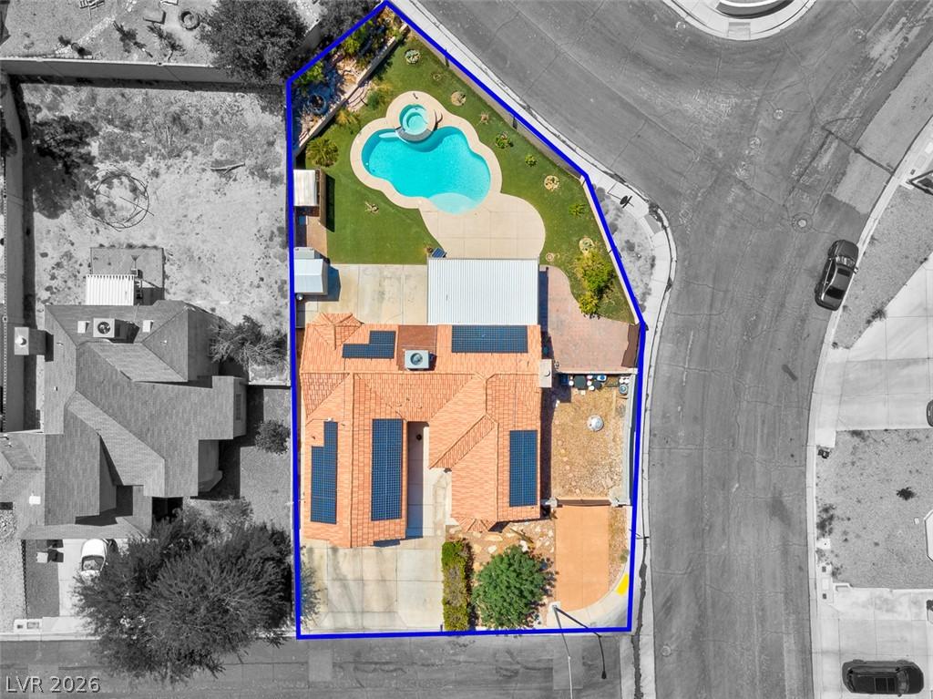 Image 2: An aerial perspective reveals a private pool and s