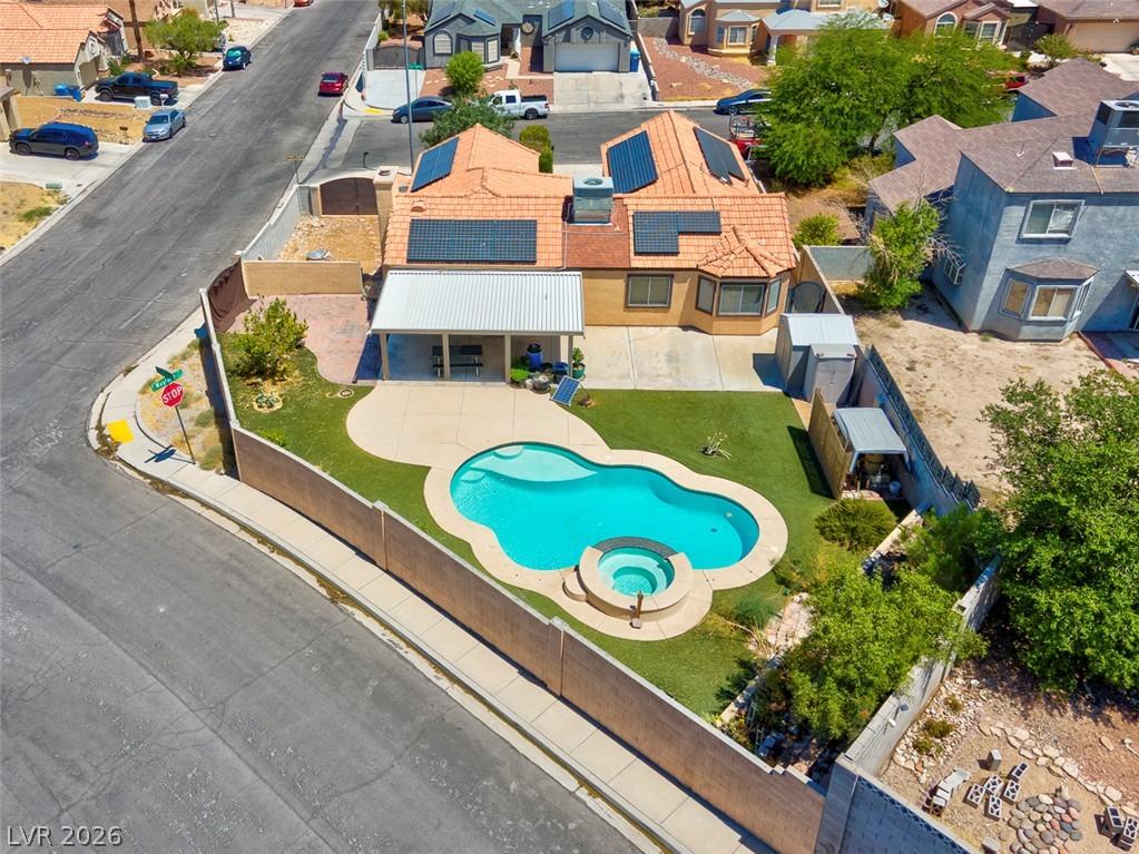 Image 3: An aerial view reveals a captivating backyard oasi