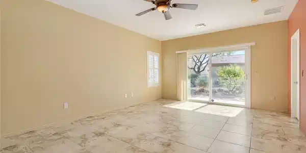 Image 3: Sliding glass doors open directly to the outdoor p