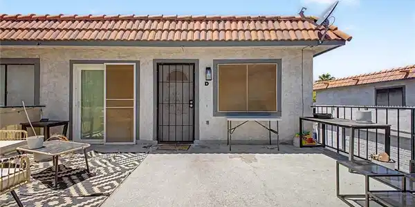Image 2: This residence features a patio for outdoor enjoym