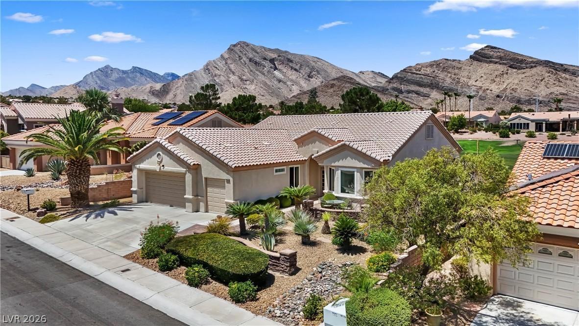 Image 1: A desert oasis home with mature landscaping and so