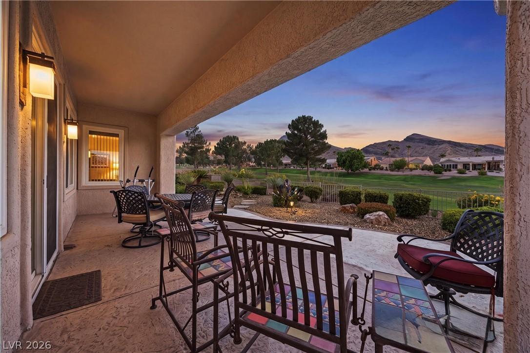 Image 2: A spacious covered patio provides a comfortable re