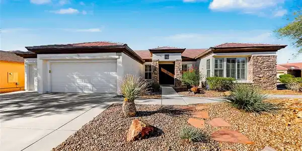 Image 2: Stone accents and desert landscaping define the ex