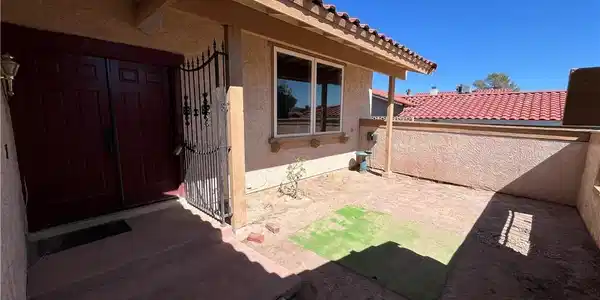 Image 2: Private, gated courtyard leads to a double entry d