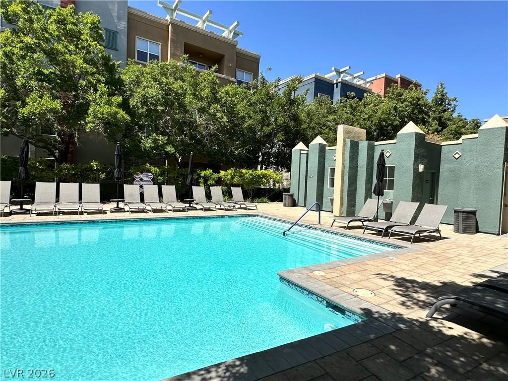 Image 3: This inviting community pool area features ample s