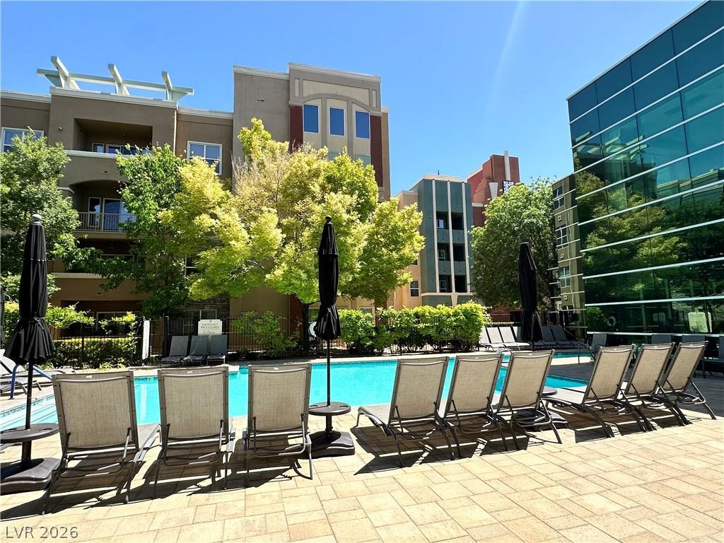 Image 4: Relax poolside with ample seating and enjoy the co