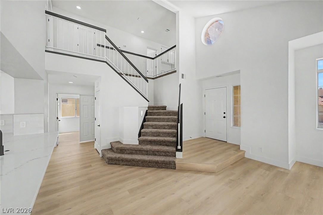Image 3: A grand entrance with high ceilings, featuring a s