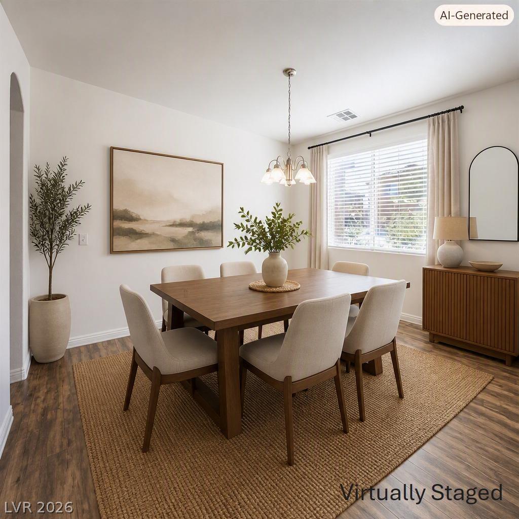 Image 4: Warm wood flooring extends throughout this well-li