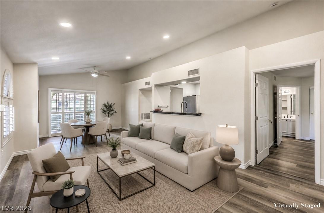 Image 1: An inviting living space featuring vaulted ceiling