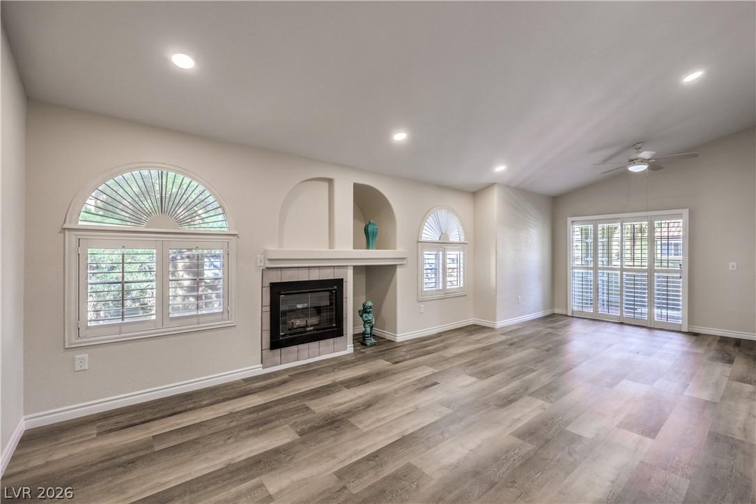Image 4: A well-lit living space showcasing a fireplace wit