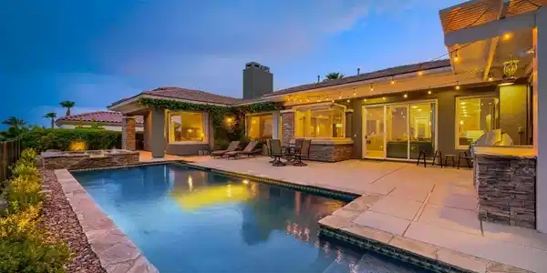 Image 4: An inviting backyard oasis offers a sparkling Pool