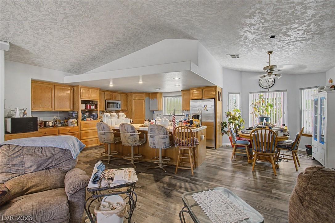 Image 3: An open floorplan seamlessly connects the kitchen