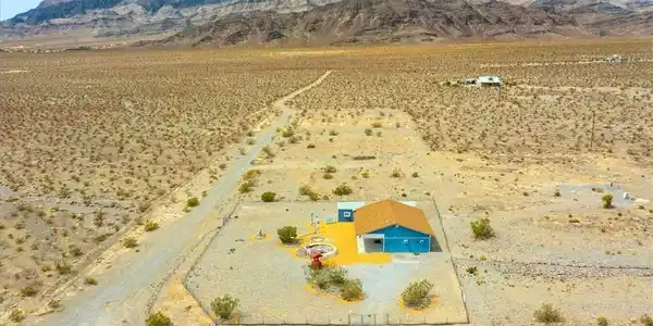 Image 3: View of rural area featuring a mountainous backgro