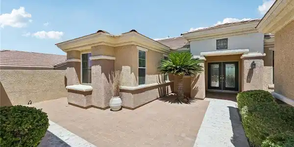 Image 4: A well-maintained paved courtyard provides a welco