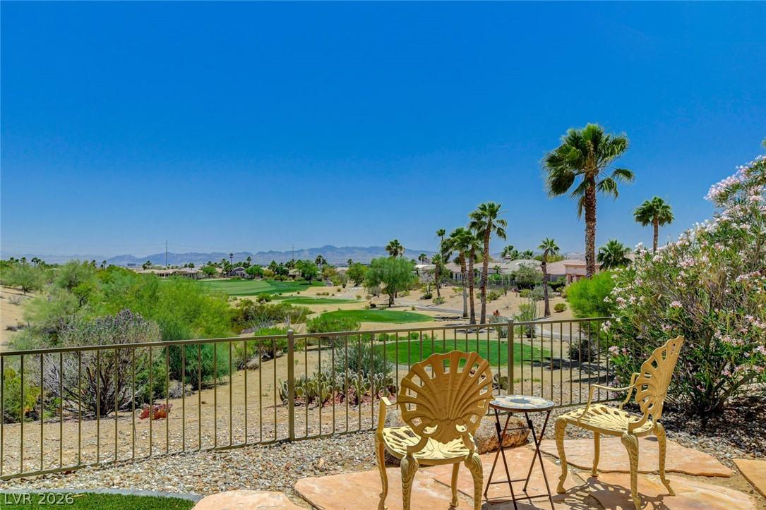 Image 3: A tranquil golf course vista unfolds from this ele