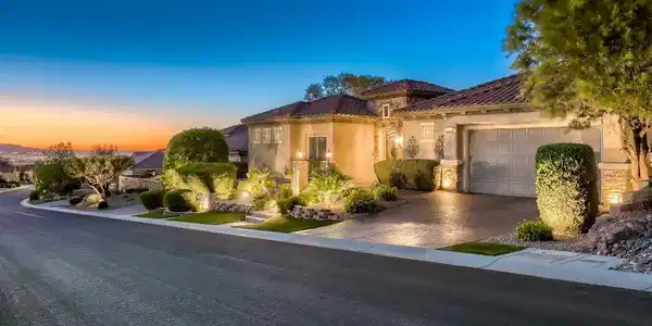 Image 3: A quiet residential street frames the stone accent