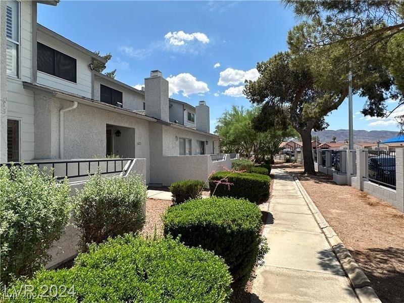 Image 3: Well-maintained community walkway leads to charmin