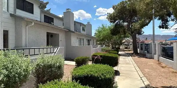 Image 3: Well-maintained community walkway leads to charmin
