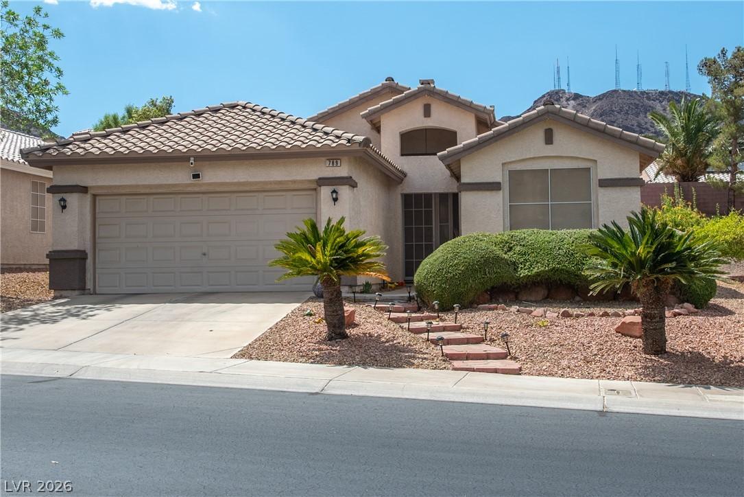 Image 1: A desert-friendly landscape surrounds this charmin