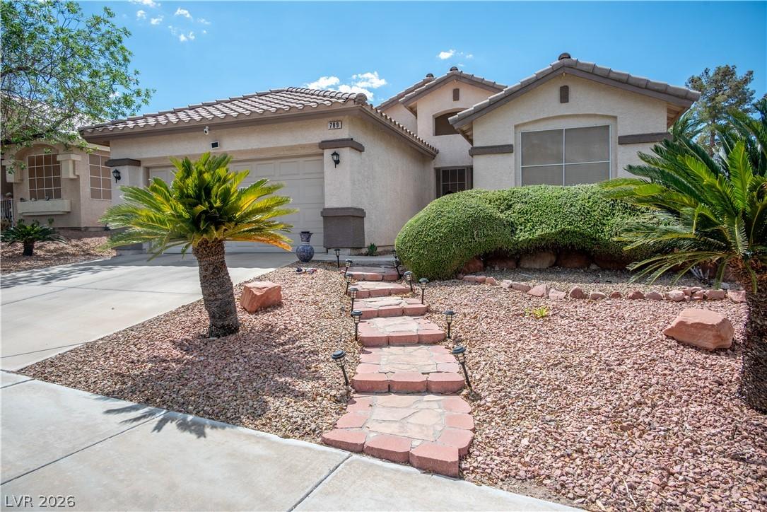Image 2: A welcoming front yard with a charming stone pathw
