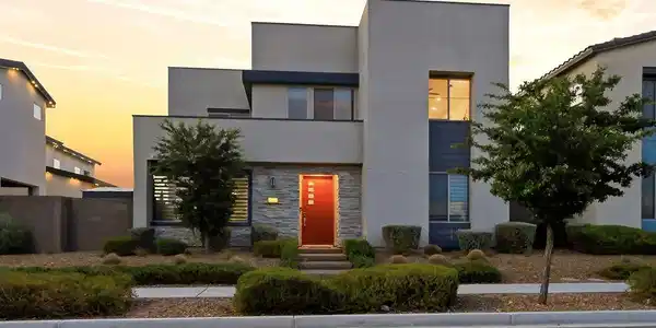 Image 3: Bold modern architecture with a striking red door