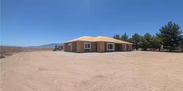 Image 4: A newly framed single-story residence awaits finis
