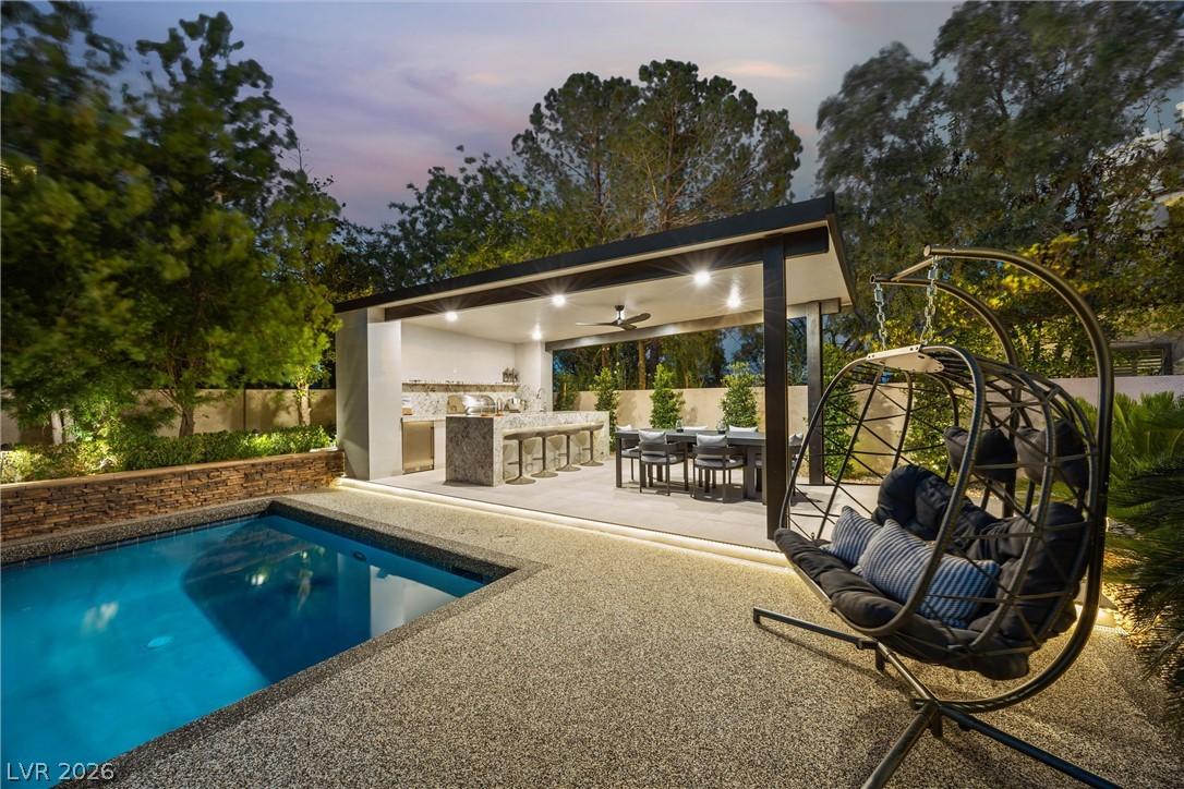 Image 2: An inviting outdoor living space features a sparkl