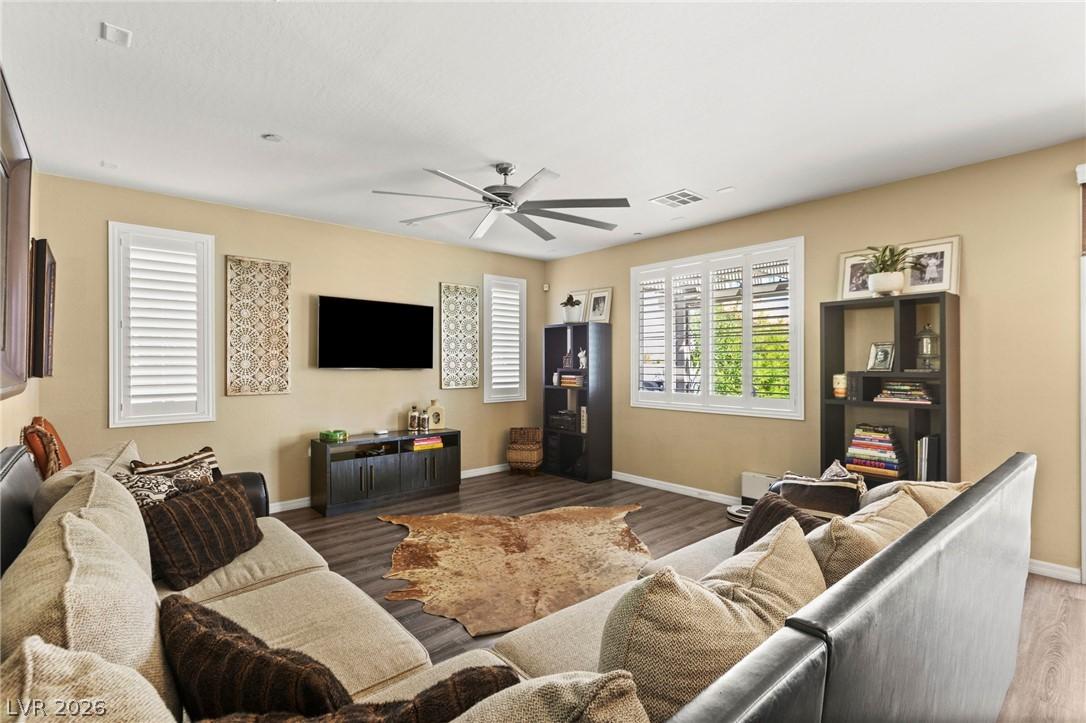 Image 3: Relax in this inviting living area featuring beaut