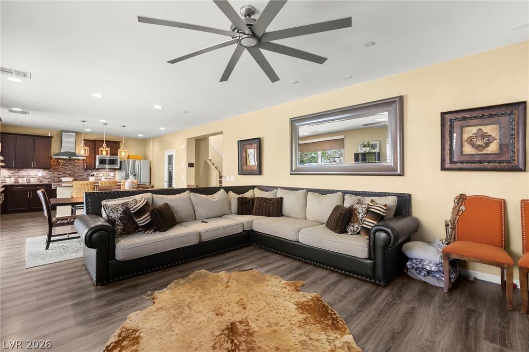 Image 4: An open-concept living space integrates a well-app