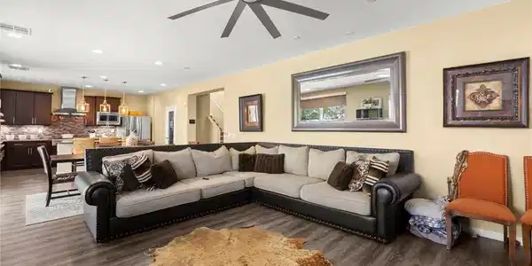 Image 4: An open-concept living space integrates a well-app