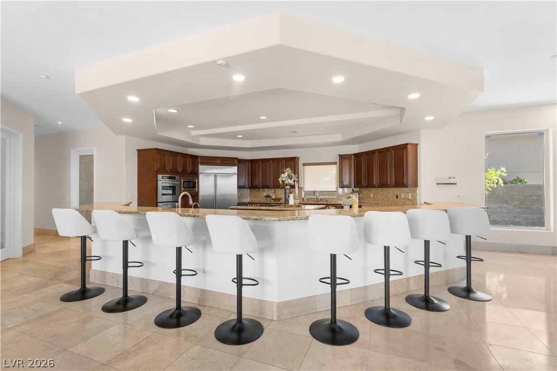 Image 3: An inviting kitchen with a substantial island and
