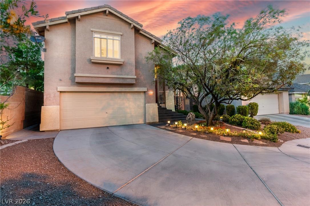 Image 1: A gracefully curved driveway guides to this inviti