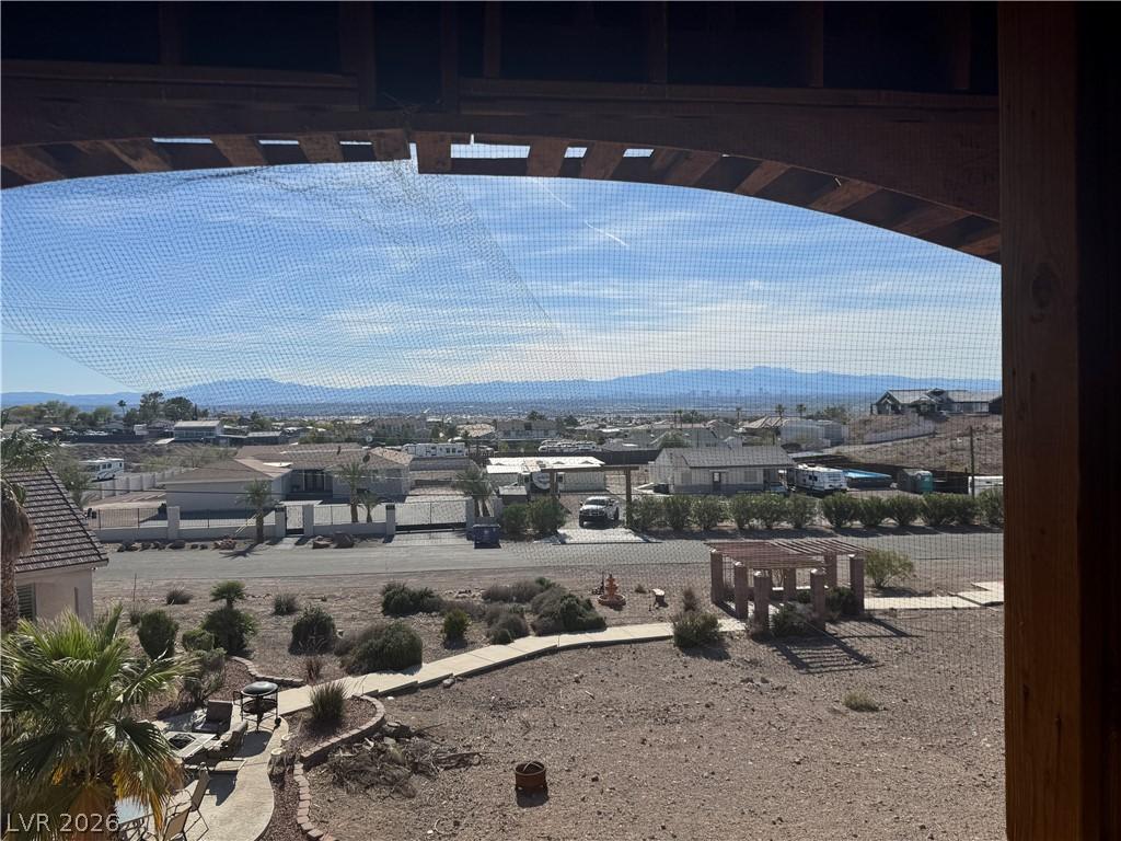 Image 2: Framed by a rustic archway, panoramic desert vista
