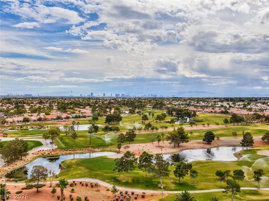 Image 2: View of urban area featuring a golf course, a larg